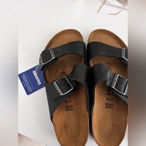 Birkenstock Arizona slides. New with tags. No box. Never worn, just too big.